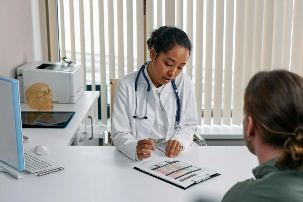 Doctor checking patient's report